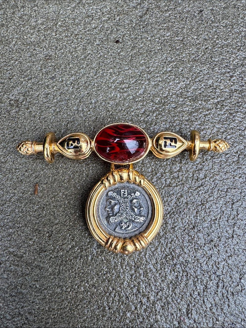 FENDI VINTAGE GOLD TONE BROOCH PIN WITH RED CABOCHON & COIN MEDALLION